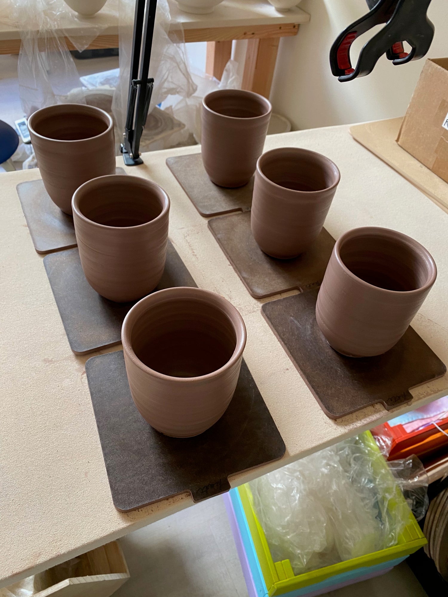 six freshly thrown mug bodies still on their bats
