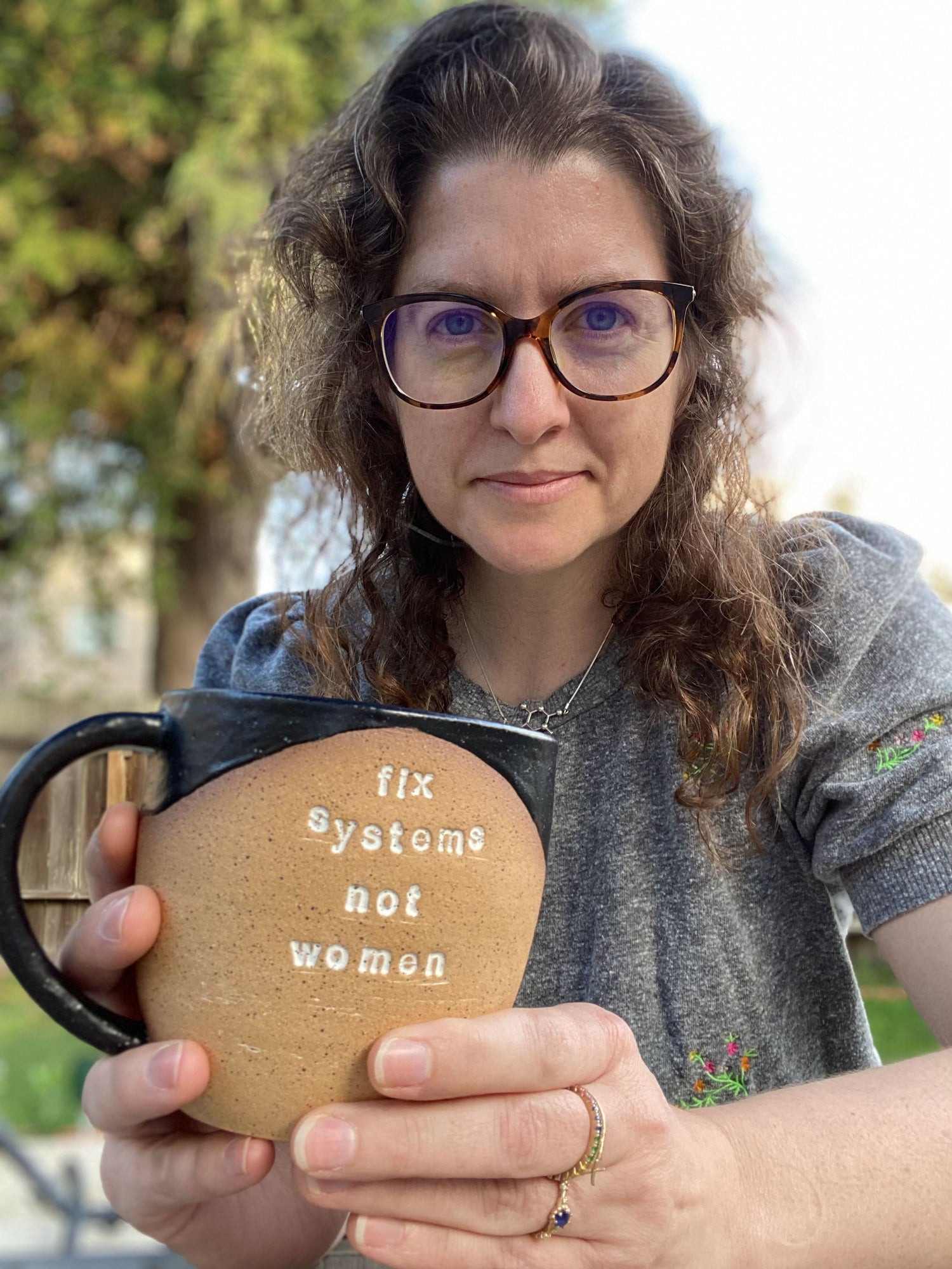 photo of Kate holding an early black and white fix systems not women pot