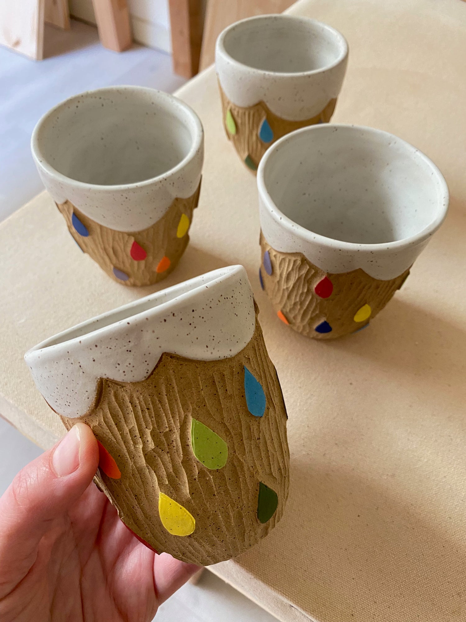 cups with rainbow raindrops