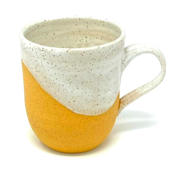 the back of the mug, with white glaze swooping down the back.